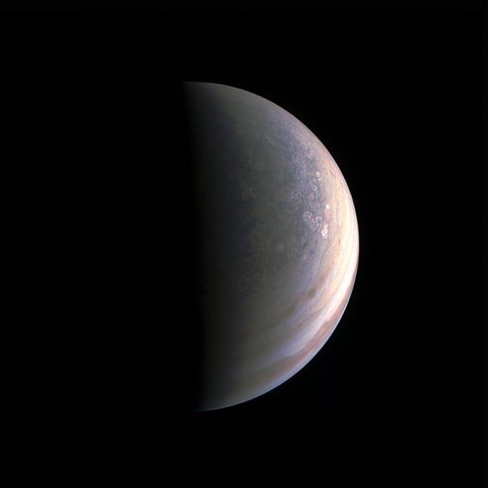 NASA Juno's spacecraft takes a picture while approaching Jupiter's North Pole