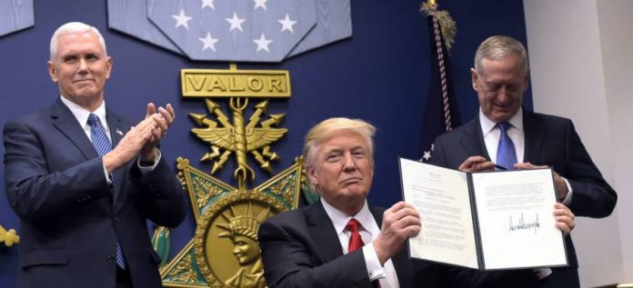 President Trump signs anti-Muslim executve order.