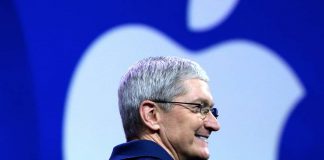 Tim Cook-smiling-Apple logo