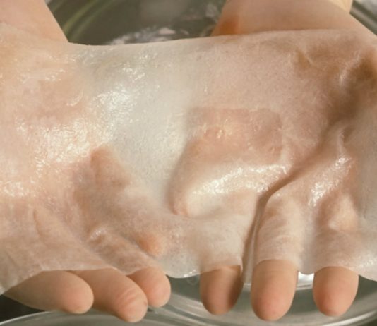 Oxford researchers aim to create robots to grow human skin scientists-hands-hold-artificial-skin-825x550