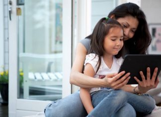 Mother and daughter using a tablet