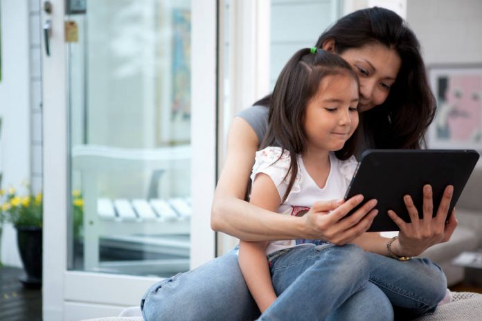 Mother and daughter using a tablet