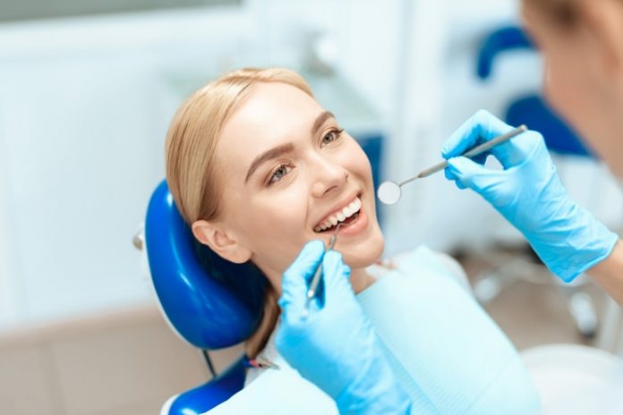 woman-dental-treatment Woman Getting Dental Treatment