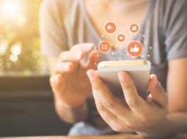 The Psychology of Social Media: Why We Like, Comment, and Share Online Woman Using Social Media