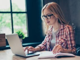 Young Woman Writing Dissertation