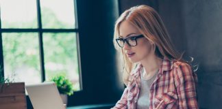 Young Woman Writing Dissertation