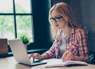 Young Woman Writing Dissertation