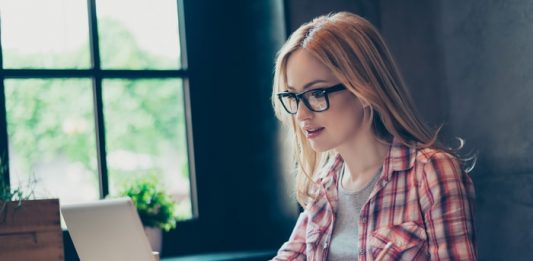 Young Woman Writing Dissertation