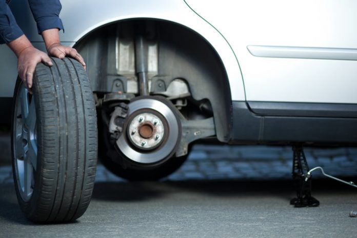 Mechanic Changing Old Tire